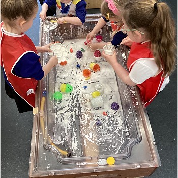 students doing messy play